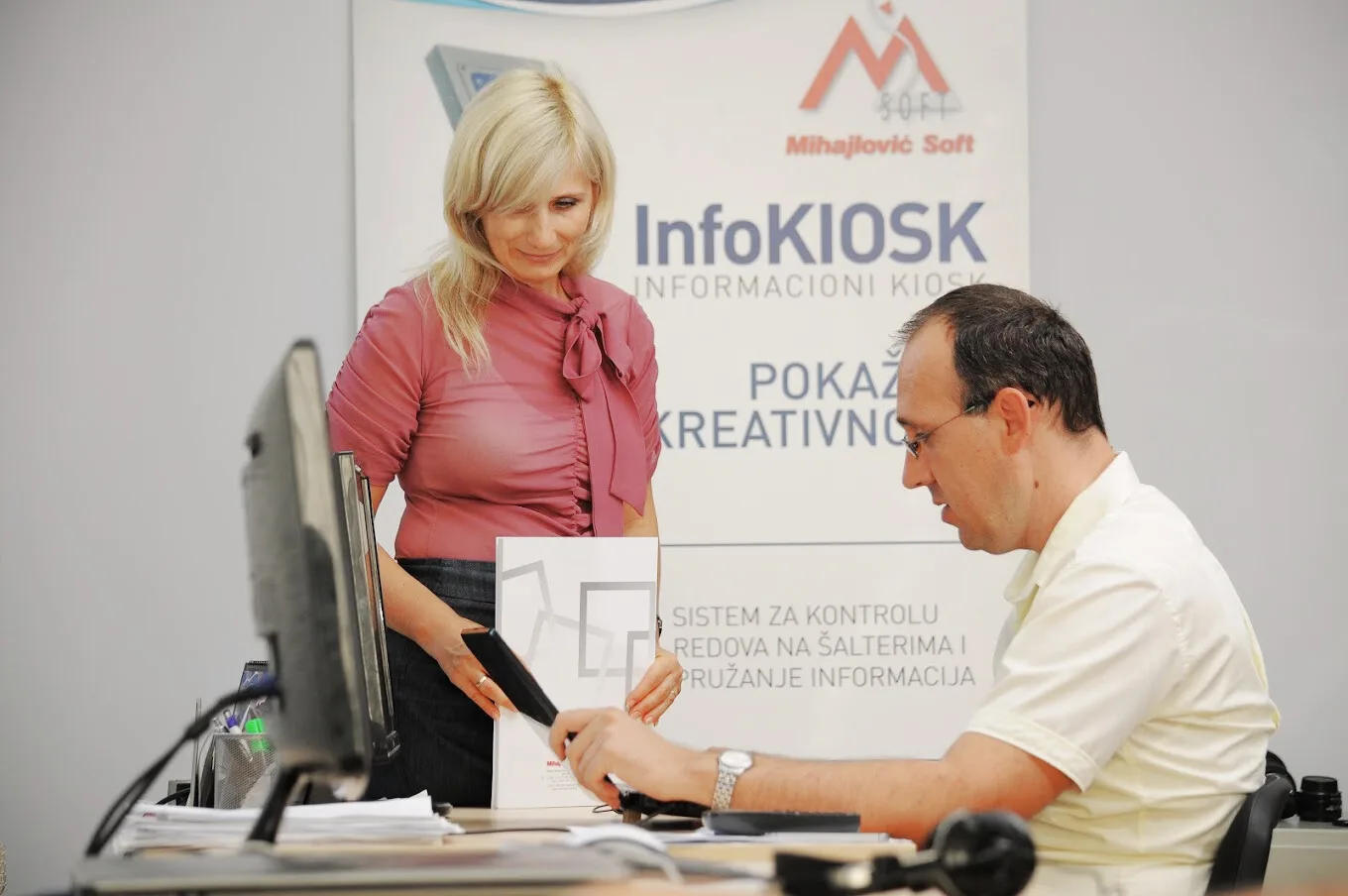 Mihajlovic Soft employees sitting at desk in office